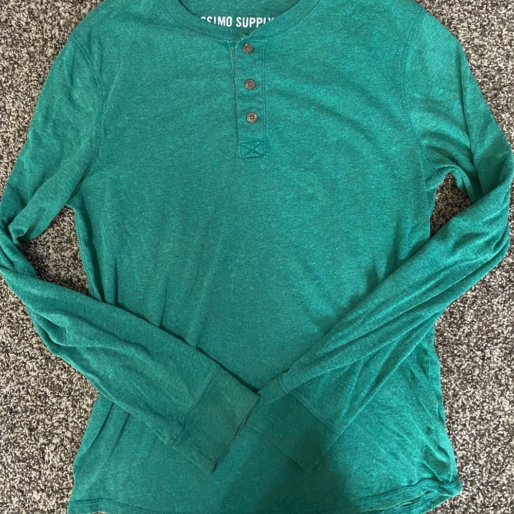 Green shirt with buttons at the top